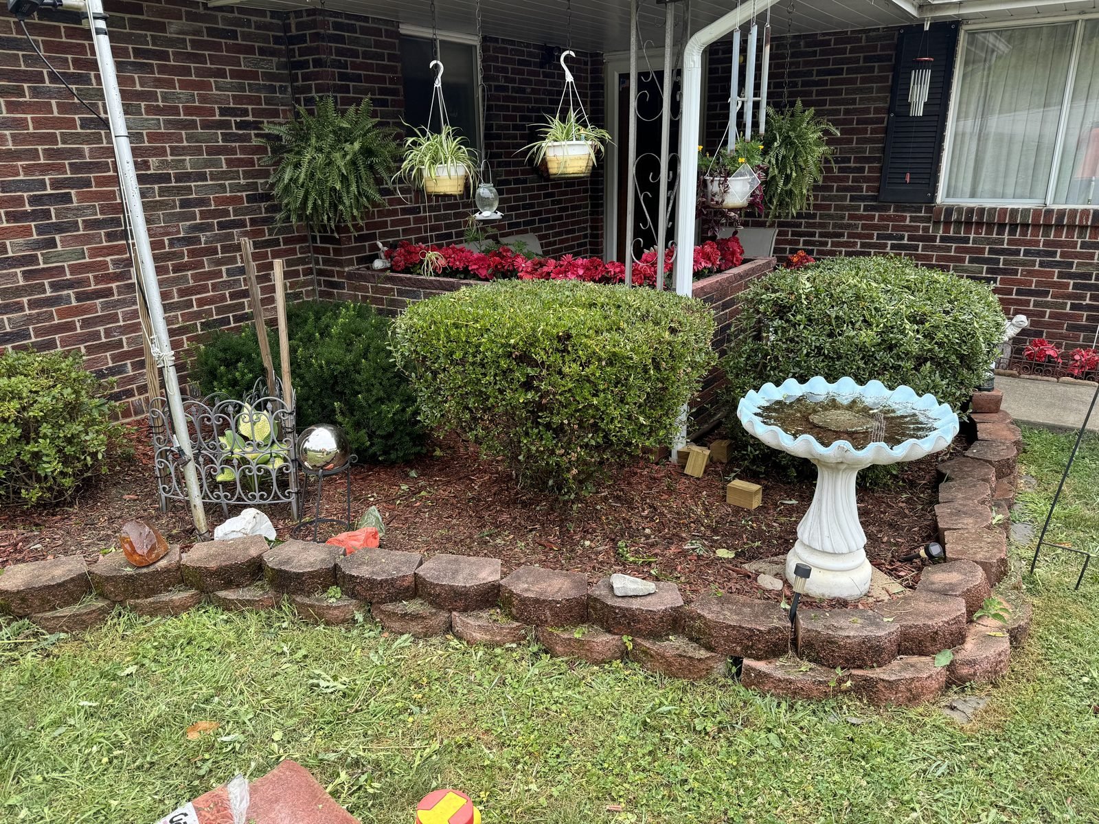 Freshly mulched landscape bed after cleanup