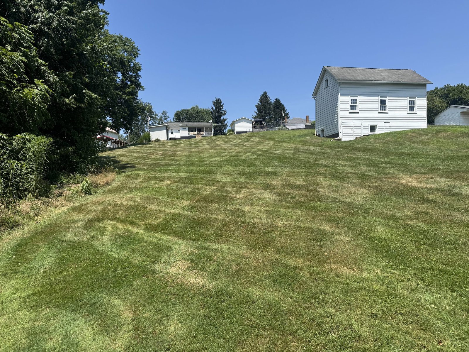 Freshly striped lawn on a Washington County, PA hillside property